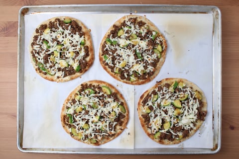 Quick Cheesy Ground Beef & Zucchini Naan Pizzas - Step #3 Assemble & bake the pizzas